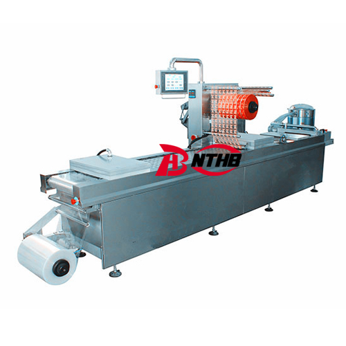 Automatic thermoforming vacuum packaging machine